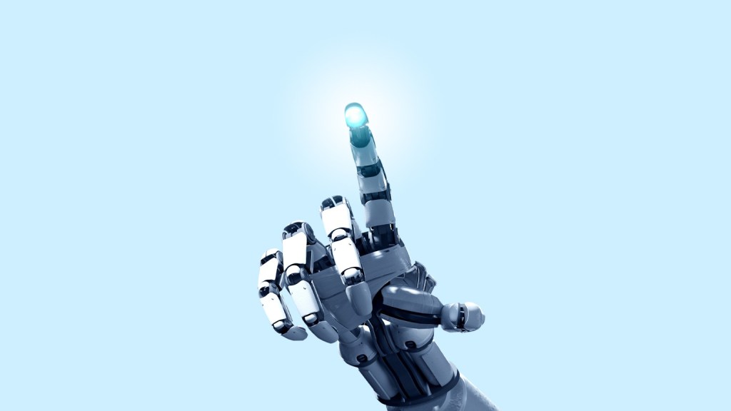 A robotic hand with a metallic, articulated design is shown pointing upward with its index finger extended. The fingertip emits a bright blue light, creating a glowing effect against a light blue background. The hand appears futuristic and mechanical, emphasizing advanced technology.